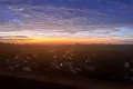 Sonnenaufgang über dem Mittelmeer vom Balkon der privaten Ferienwohnung L’Aubergine Bellevue im Oktober